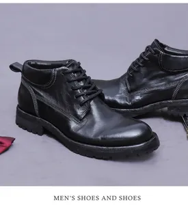 Detailed close-up of premium black leather boots with durable stitching and waxed laces