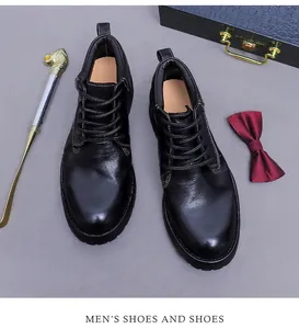 Detail shot of vintage black leather boots with Goodyear welt stitching and business props