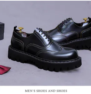 Detail of black leather oxford shoe with colorful stitching and sawtooth platform sole