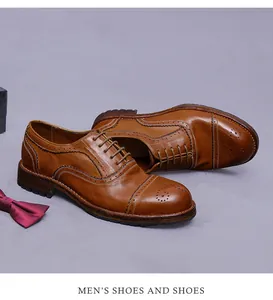 Detailansicht brauner Brogue-Lederschuhe mit klassischer Lochverzierung und Fliege