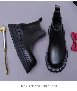 Detailed macro view of black suede Chelsea boots featuring elastic side and non-slip sole