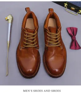 Top-down view of brown leather boots with lace-up detail and vintage accessories