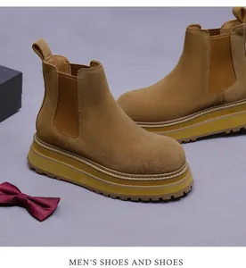 Detailed view of brown suede Chelsea boot showing elastic side and thick platform sole