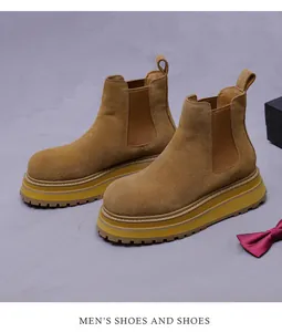 Overhead view of tan suede Chelsea boots with lug sole and elastic side panels