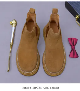 Top view of brown suede Chelsea boots with white stitching and thick anti-slip soles