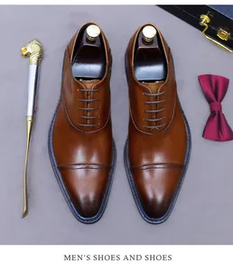Close-up of premium brown leather cap toe oxford shoes with unique blue stitching detail