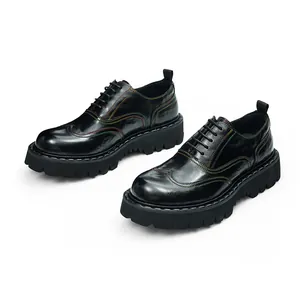 Detail view of black platform oxfords featuring vibrant rainbow stitching and thick rubber soles