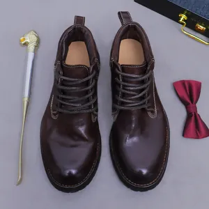 Deep brown vintage leather boots for men with polished finish and premium accessories