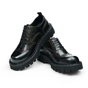 Detail of black leather oxford shoes with colorful contrast stitching and chunky sole