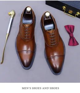 Classic dark brown leather oxford shoes with elegant stitching and premium gradient finish