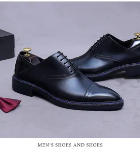 Classic black leather oxfords with blue welt stitching shown with elegant suit accessories