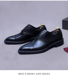 Detail view of black leather oxford shoes featuring unique blue welt stitching and cap toe