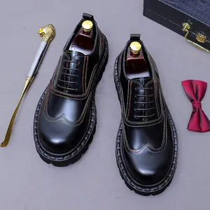 Men's leather oxford shoes with colorful contrast stitching and wingtip brogue details