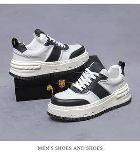 Λεπτομέρεια ανδρικών δερμάτινων sneakers με ασπρόμαυρη αντίθεση και χοντρή σόλα πλατφόρμας