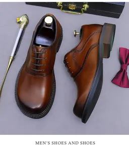 Close-up of brown Oxford brogue shoes with decorative perforation and gradient finish