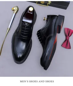 Classic black leather brogue shoes with wingtip perforations and luxury accessories