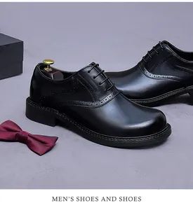 Detailed view of black genuine leather Oxford shoes with classic Brogue wingtip carving