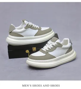 Detail of premium white leather sneakers with chunky sole and khaki grey accents