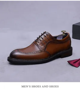 Detail of brown leather oxford shoes with crocodile pattern and brogue carving texture
