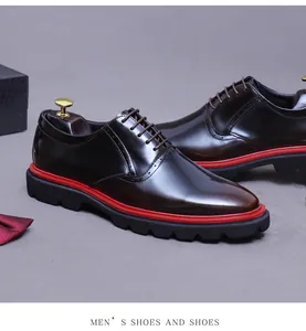 Detail of burgundy oxford shoe featuring brogue perforations and contrast thick sole