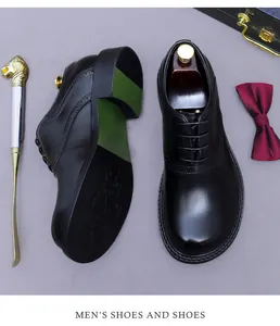 Close-up of black leather brogue shoes with classic wingtip carving and oxford details