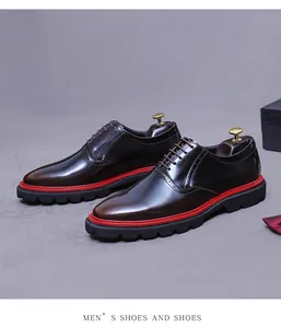 Detailed macro view of brown leather oxford shoe with brogue patterns and red midsole accent