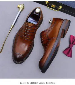 Brown leather brogue shoes detail with crocodile texture and elegant accessories