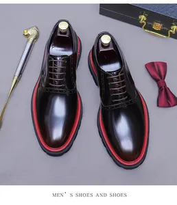 Top view of shiny dark brown Oxford shoes with classic brogue details and red layered soles