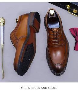 Detail of brown leather Oxford shoes with brogue perforations and anti-slip rubber soles