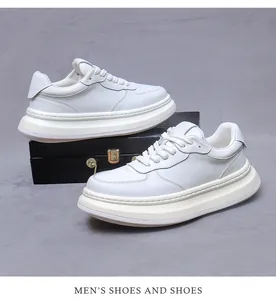 Detail shot of men's premium white leather sneakers with thick platform soles and laces