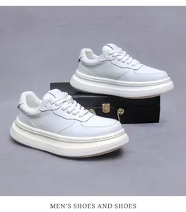 Detailed close-up of premium white leather men's sneakers with thick platform soles