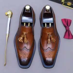 Mocassins à pampilles en cuir marron avec détails richelieu et finition cirée