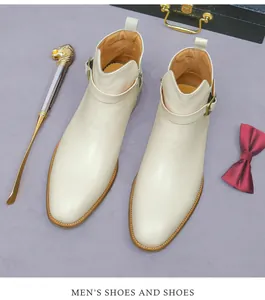 Top-down view of men's beige leather boots with side zipper and buckle strap detail