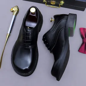 Men's black leather brogue oxford shoes with decorative carving and round toe