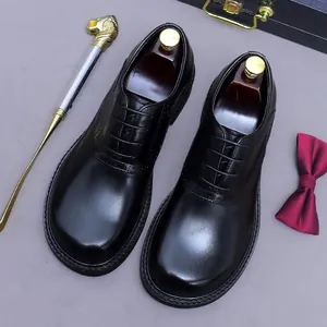 Classic black leather brogue oxford shoes with elegant wingtip details and wooden shoe trees