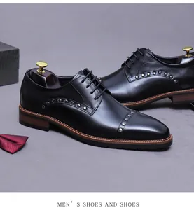 Close-up of black leather derby shoes with silver studs and professional shoetree