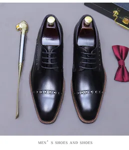 Top view of premium leather derby shoes with decorative metal rivets and luxury packaging
