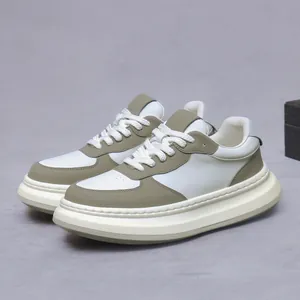 Men's olive green and white leather platform sneakers with oversized soles and thick laces