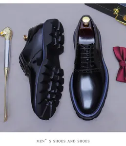 Polished black leather oxford shoes with blue stitching and thick lug sole in business setting