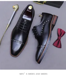Detail of black leather dress shoes with metal rivets and elegant business accessories