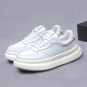 Premium white leather platform sneakers for men featuring thick soles and minimalist style