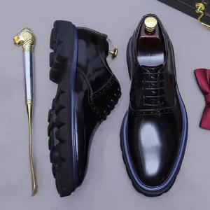 Polished black leather Oxford shoes for men with thick lug soles and brogue detailing
