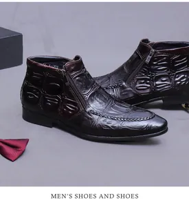 Detail view of brown leather boots with crocodile texture and side zipper