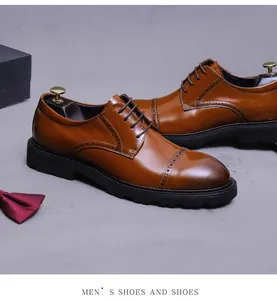 Detail of premium brown leather brogue shoe with vintage gradient finish and rubber sole
