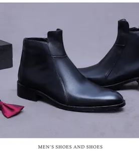 Detail van luxe zwarte lederen Chelsea boots met elegante stiksels en een hoogglans afwerking