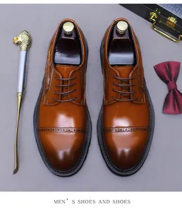 Top-down view of men's leather brogue derby shoes with elegant carved details