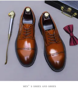 Detail shot of brown polished leather Derby shoes with classic brogue wingtip patterns