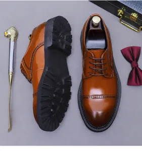 Detailed view of brown brogue dress shoes with anti-slip rubber soles and wingtip design