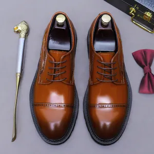 Brown leather cap toe brogue shoes with wooden shoe trees and gentleman accessories