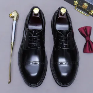 Classic black leather Derby shoes with brogue carving detail and wooden shoe trees